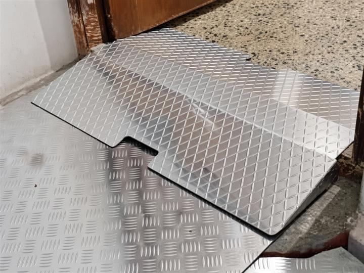 RamPlus-style diamond-plate threshold ramp at a home entrance